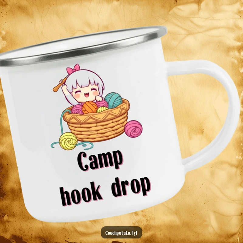 Funny, durable camping mug showing a character gleefully dropping a crochet hook into a basket of yarn, perfect for outdoor enjoyment.