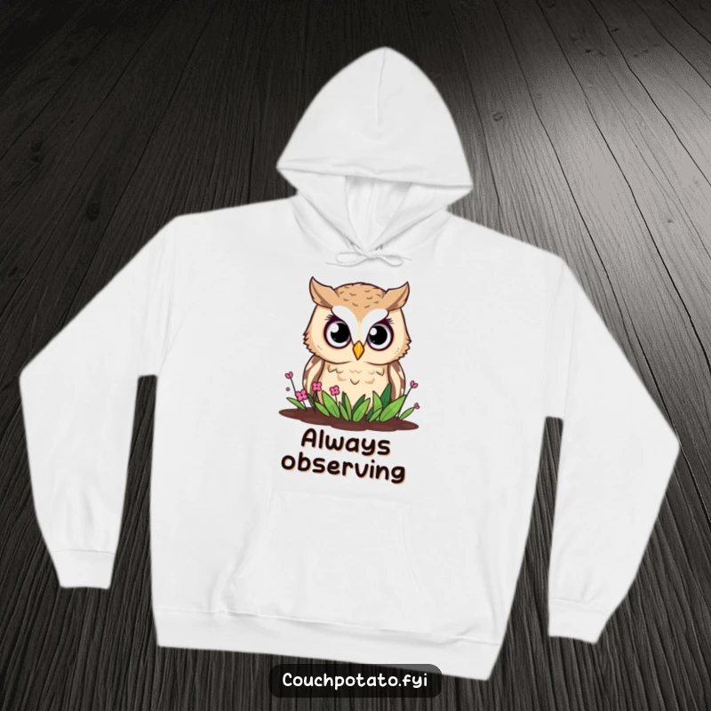 Funny owl hoodie, a curious owl with large, wide eyes intently observes a small garden bed below.
