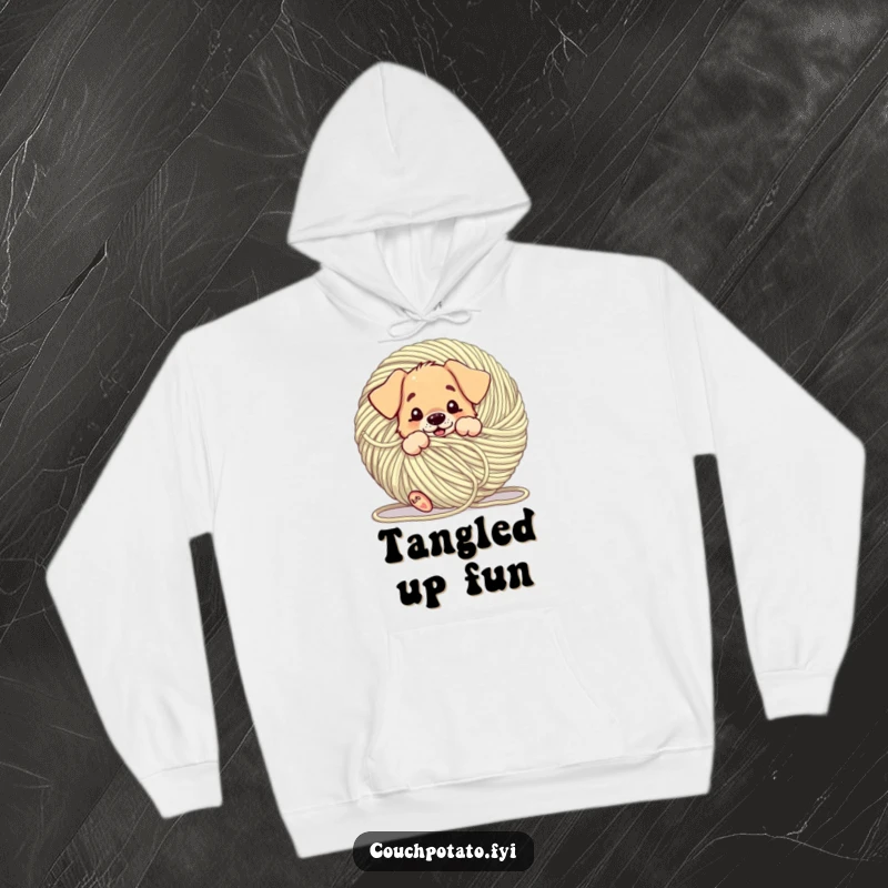 Funny puppy comically tangled in a giant ball of yarn, featured on a cozy hoodie, for humorous relaxation and warmth.