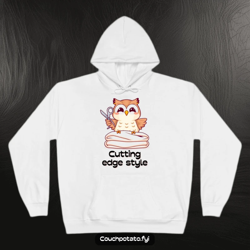 Funny, joyful owl holding scissors precariously above folded fabric, featured on a warm, funny hoodie.