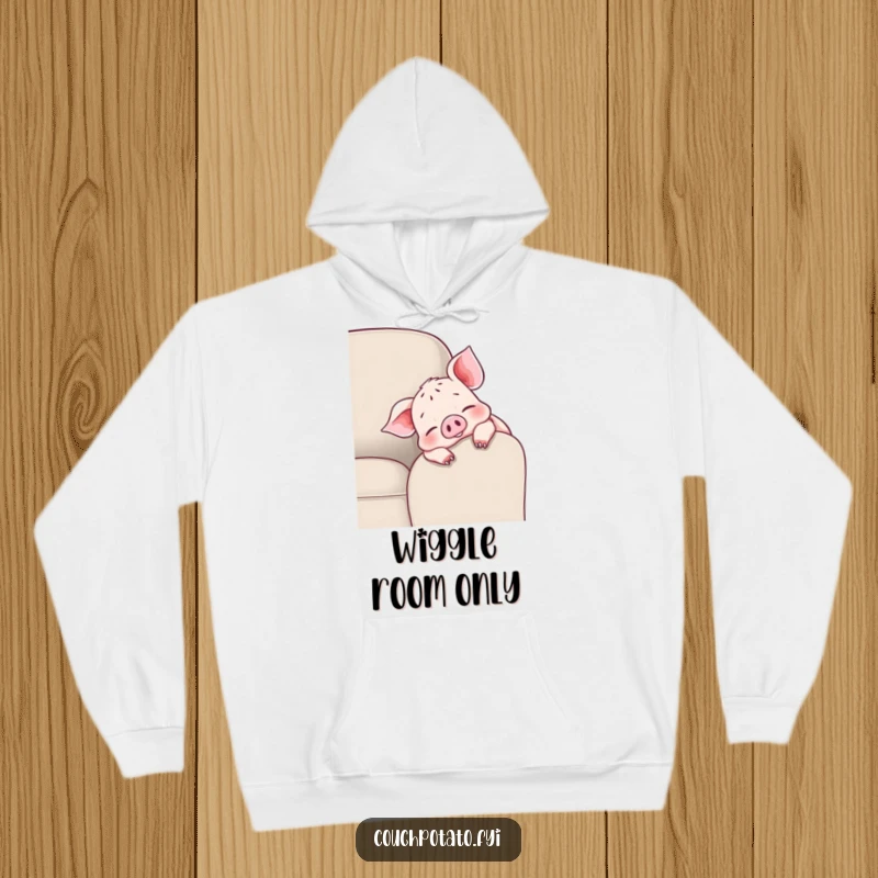 Funny cheerful piglet hoodie depicting a piglet draped over a couch armrest, wiggling toes, designed for maximum coziness and joy.