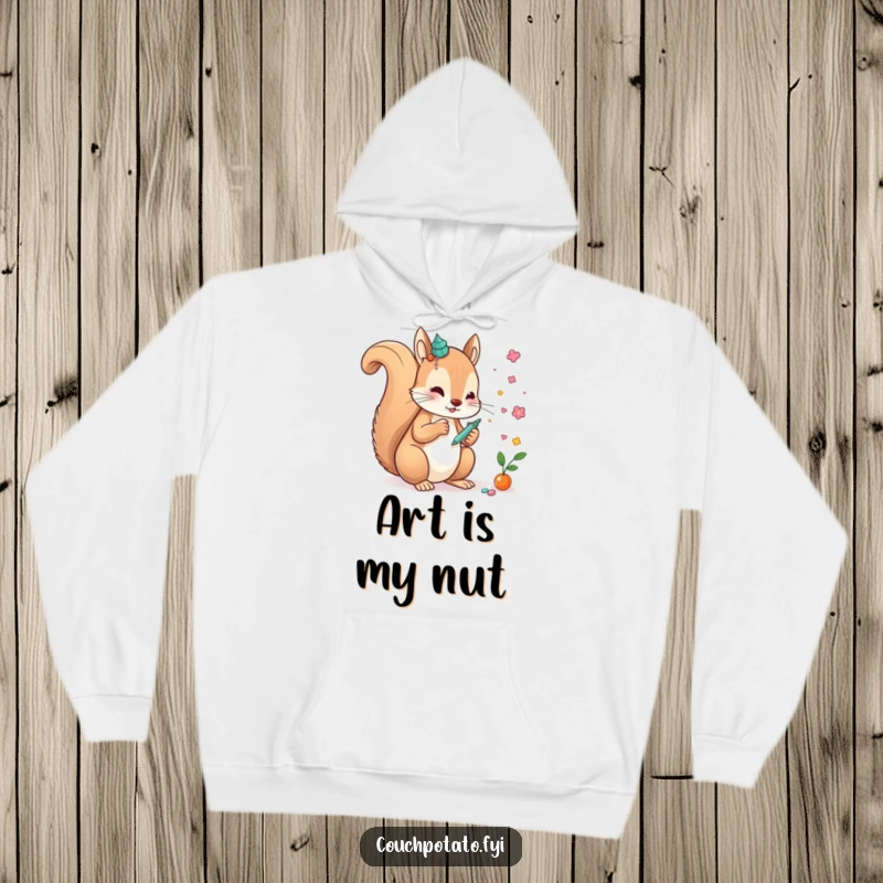 Funny, creative squirrel meticulously gluing embellishments onto a unique art piece, featured on a warm, funny hoodie.