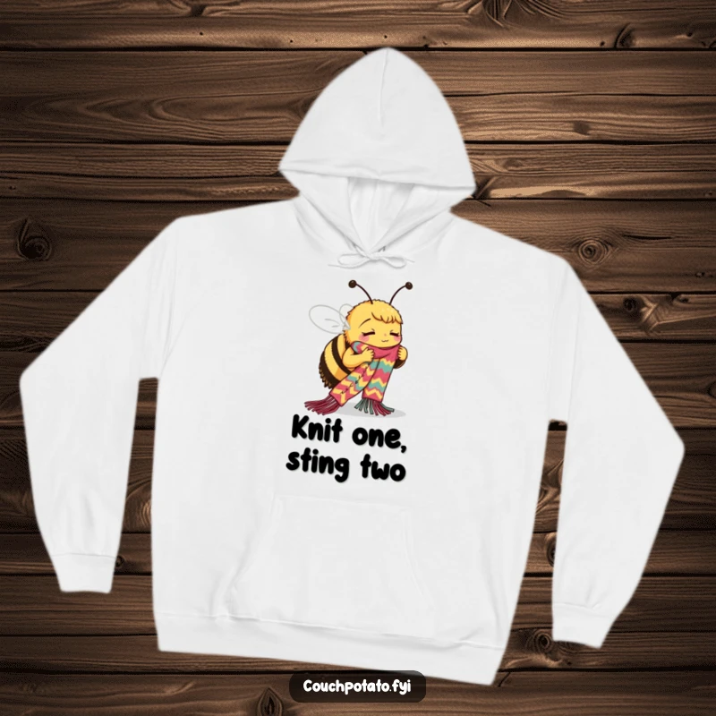 Funny Bee Hoodie: A busy bee is depicted intensely knitting a long, colorful scarf, showcasing its dedication to the craft.