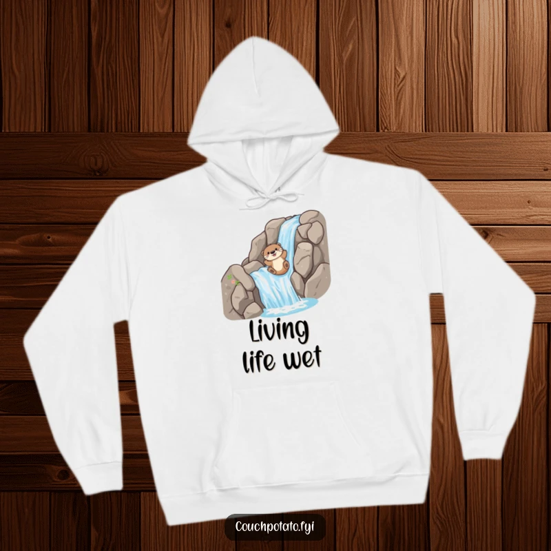 Funny Hoodie: A playful otter slides down a rocky waterfall, representing wild adventure and sheer happiness.