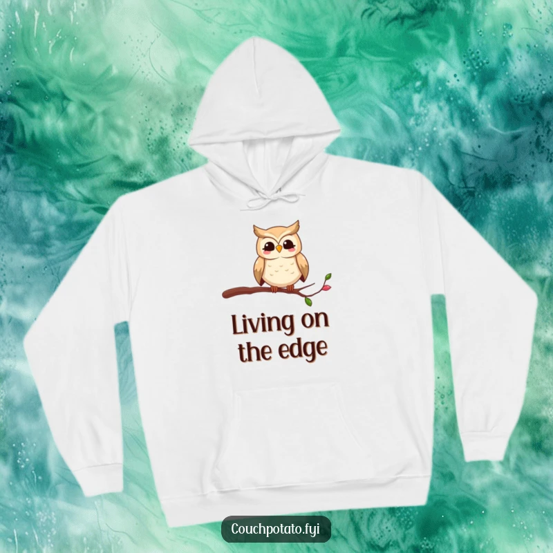 Funny owl hoodie showing a smiling bird in a comically unstable position on a slender branch, ideal for cozy, humorous wear.
