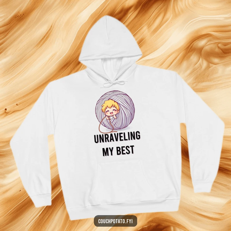 Funny hoodie design showing a character grinning while pulling a long thread from a giant ball of yarn, symbolizing endless craft possibilities.