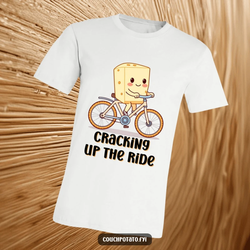 Funny cream cheese character on a cracker bike, pedaling with glee on a funny graphic tee.