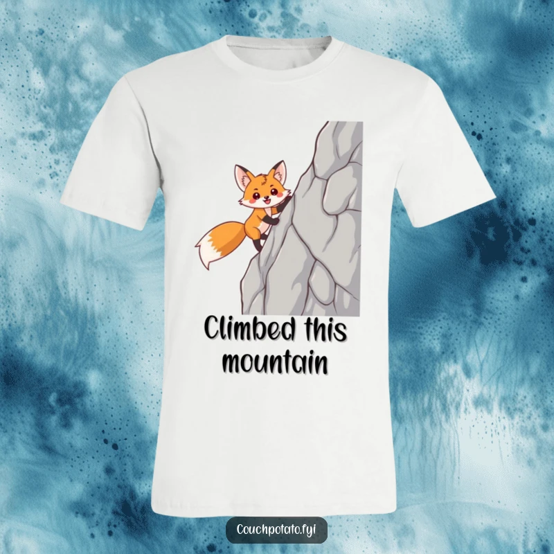 Funny fox t-shirt featuring a smiling, triumphant fox skillfully climbing a sheer rock face, embodying ambition and joy.