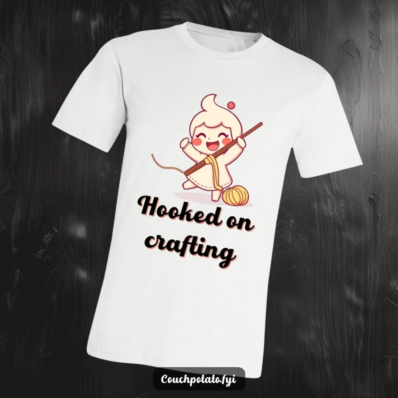 Funny smiling character swinging a big crochet hook with yarn flowing on a graphic t-shirt.