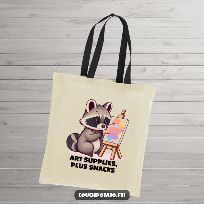 Funny curious raccoon focused on painting a small canvas on a durable tote bag, perfect for humorous errands.